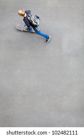 above view of a teen boy skateboarding