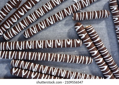 Above View Of White Chocolate Striped Milk Chocolate Dipped Pretzels