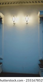 Above the wall surface, there are two hanging lamps with a minimalist design installed parallel to each other, providing soft lighting but bright enough to create a warm and comfortable atmosphere. 