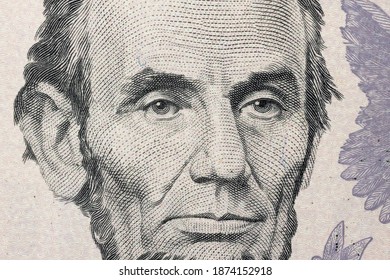 Abraham Lincoln Portrait In US Banknote Dollar Closeup Background