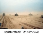 Abrams tanks of the 1st Armored Division 7th Corps move across the desert in northern Kuwait during Operation Desert Storm. Feb. 28 1991.
