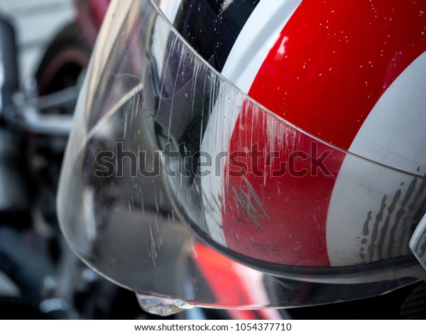 The abrasion on a Motorcycle helmet from an\
accident on the road.