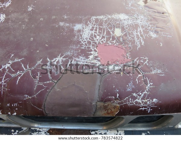 Abrasive car color\
and rust on the car\
bonnet