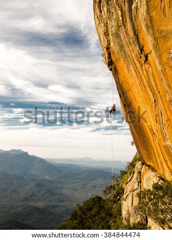 Similar – Rock climbing team bivouaced in a storm.