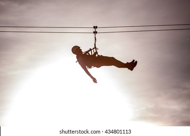 abseiling in the sun, rider on the zip line, zipline, zip-line - Shutterstock ID 434801113