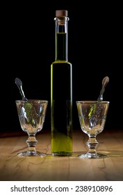 Absinthe Bottle, Two Glasses, Isolated On Black