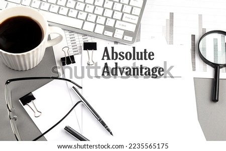 ABSOLUTE ADVANTAGE text on a paper with magnifier, coffee and keyboard on a grey background