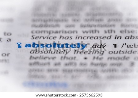 Absolutely word in a dictionary. Selective focus, close up