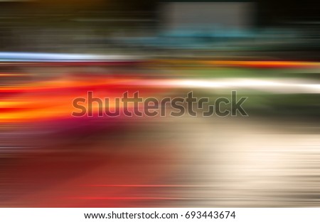 Absrtact  blurred lights of moving cars in the night city.Bokeh urban background. Blurred  moving  traffic   