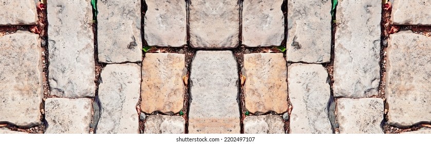 Abstract Abandoned Texturized Grungy  Symmetrical Weathered  Brick Wall. Caste of Tower  Wall. Wide Web Banner Backdrop or Background. Panoramic Natural Stone  Pattern