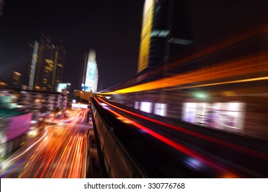Abstract Acceleration Speed Motion Light Blur From Sky Train At Night In Modern City (background)