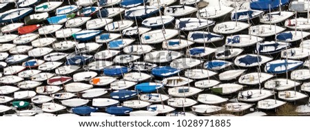 Abstract aerial view of storage of yachts in a boatyard in winter time. Boats are all packed together in this harbour in Hoorn, Netherlands. The pattern gives an abstract view.