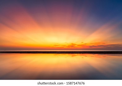 Abstract Amazing Colorful sky with sunset view in the evening or sunrise and clouds background with Reflection in water in the nature background concept