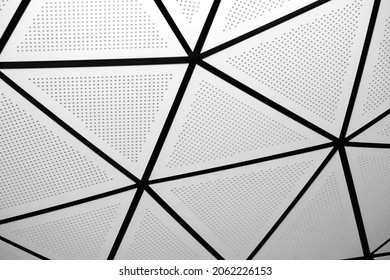 Abstract architectural element. Close up of triangular panels in modern building.
