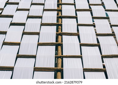 Abstract Architecture Background Cellular Texture Of Wooden Sticks And Film, Fence With Wicker Structure