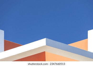 abstract architecture background. Close up geometric angular structure detail walls fragments. White, orange brown walls against blue sky. Contemporary minimalist architectural photography. Exterior. - Powered by Shutterstock