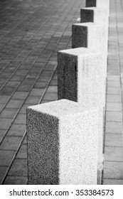 Abstract architecture composition, white square bollards in a row