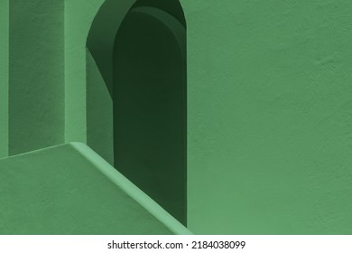 Abstract architecture forms for background. Green painted wall details with smooth surfaces with geometric shapes. empty straight and curved lines design. concept of minimalism, balance, modern. 