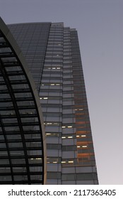 Abstract Architecture View Of Dramatic City Buildings. Triangular Angular Architectural Detail Of Modern Building Structure. Futuristic Urban Glass And Steel Facade Commercial Constructions. 