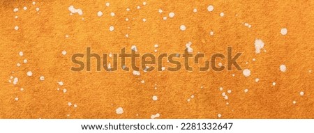Abstract art background bright orange and red colors. Watercolor painting on canvas with soft amber gradient. Fragment of artwork on paper with white spotted pattern. Texture backdrop.