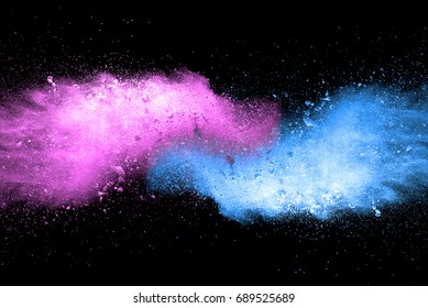 Abstract art colored powder on black background. Frozen abstract movement of dust explosion multiple colors on black background. Stop the movement of multicolored powder on dark background. - Shutterstock ID 689525689