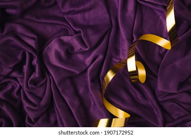 Abstract art concept purple silk or saten backround with golden ribbon. Party of birthday idea with copy space. - Shutterstock ID 1907172952