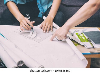 The abstract art design background of the architect working on project.hand of boss was point to drawing paper,work togetherness, - Powered by Shutterstock