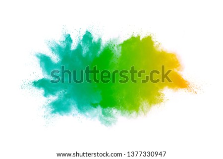 Abstract art powder paint on white background. Movement abstract frozen dust explosion multicolored on white background. Stop the movement of colored powder on white background. 
