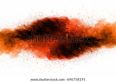Abstract art powder paint on white background. Movement abstract frozen dust explosion multicolored on white background. Stop the movement of colored powder on white background.