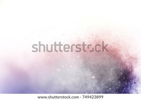 Abstract art powder paint on white background. Movement abstract frozen dust explosion multicolored on white background. Stop the movement of colored powder on white background.
