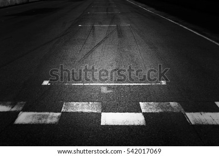 Abstract asphalt black Start and Finish grid line for race car in circuit texture background, Automobile and automotive background concept.
