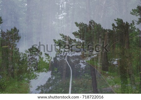 Similar – View through the reflective pane over a terrace onto the coast of Western Canada