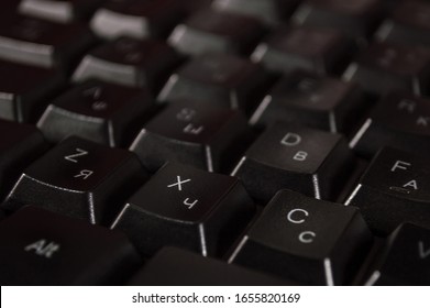 Abstract background of black computer keyboard. Closeup photo with bokeh, can be used like a wallpaper.