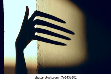 Abstract Background. Black Shadow Of A Big Hand On The Wall. Silhouette Of A Hand On The Wall. Nightmares In Children.  Scary Dreams. 