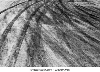 Abstract background black tire tracks on cement road, tire marks.