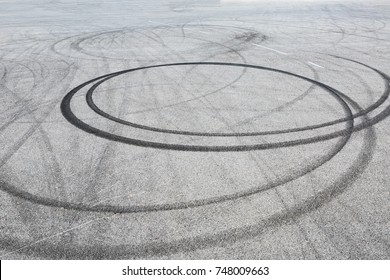 Abstract Background Black Tire Tracks Skid On Asphalt Road,high Angle Shot View In Racing Circuit