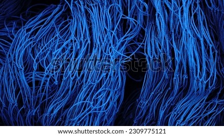 abstract background of blue fishing net threads