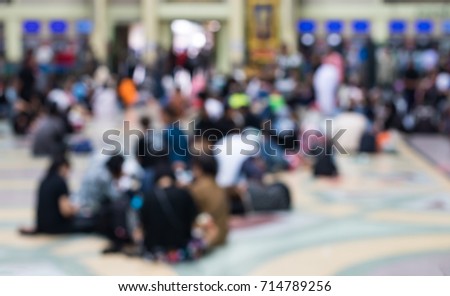 Abstract background, blurred crowd waiting for a ride in Bangkok Thailand Railway Station.