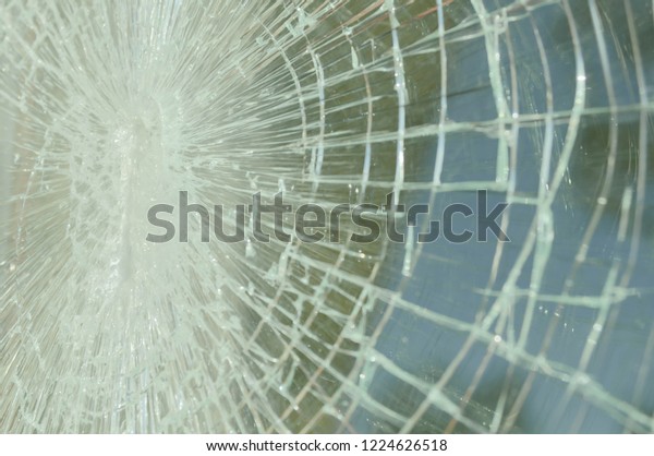 Abstract\
background with broken glass. Cracked\
glass.