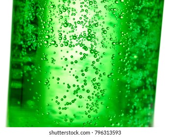 Abstract Background : Bubble Of Sparkling Water Soda On The Green Glass Bottle With Gradient Light