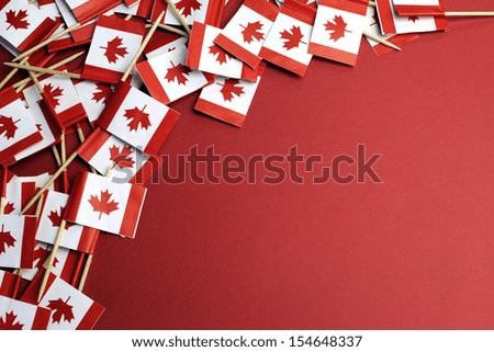 Abstract background of Canada red and white Maple Leaf national toothpick flags for travel, national emblem, food background, or public holiday event, with copy space for your text here.