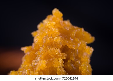 Abstract background of cannabis concentrate live resin macro detail extracted from medical marijuana