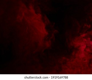 Abstract Background Of Chaotically Mixing Puffs Of Red Smoke On A Dark Background