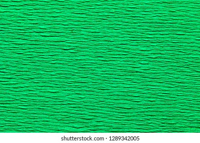 Abstract Background Of The Close Up Detail Of A Green Sheet Of Crepe Paper