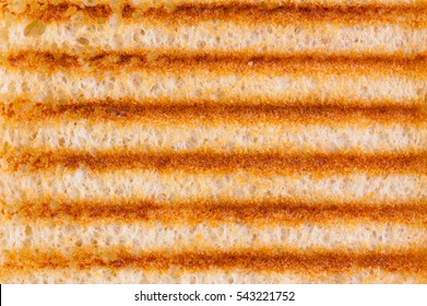 Abstract Background Of Close Up On Toasted Bread With Grill Marks