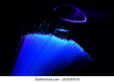 abstract background with colored fibers optics reflected on glass sphere