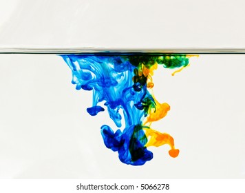 Abstract background of colorful dye drifting through water