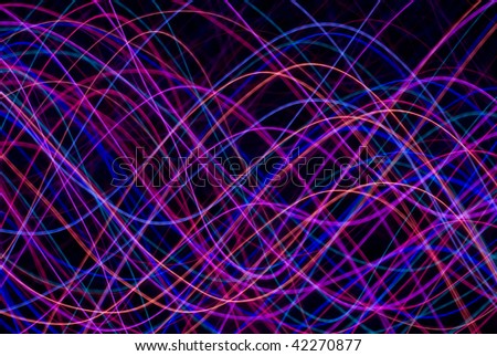 abstract background of colourful sinusoidal waveforms in red pink magenta and blue