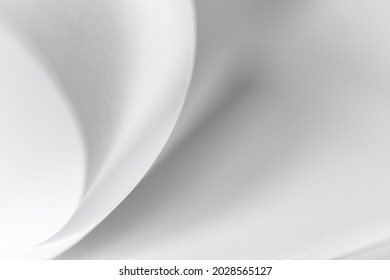 Abstract Background Of Curved Sheets Of Paper Close-up With A Shallow Depth Of Field (blurred)