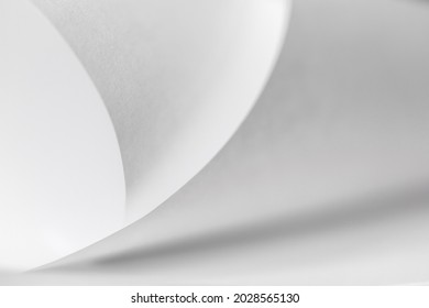 abstract background of curved sheets of paper close-up with a shallow depth of field (blurred)